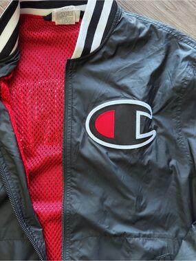 Champion Black Jacket with Red Mesh Lining and Patch Logo